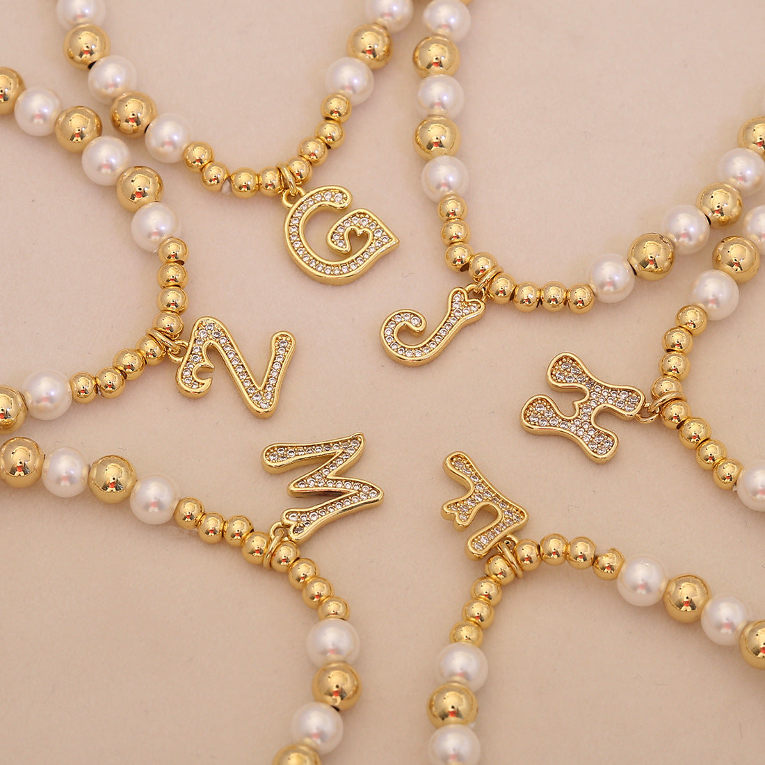 Diamond initial letter charm pearl bead gold bead bracelet